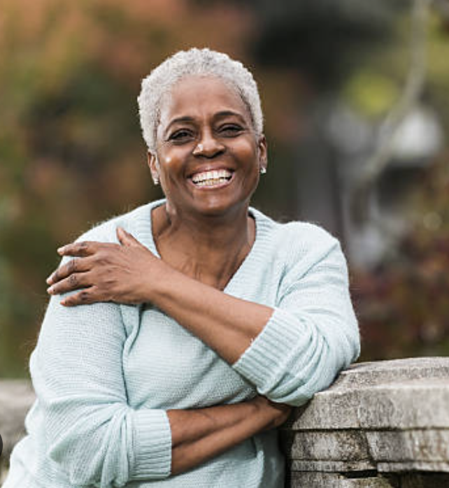 Mrs. Eleanor Parks smiling warmly outdoors